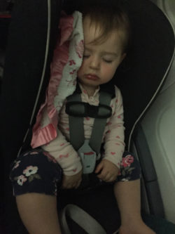 Shoshana asleep in her carseat on the flight to Ireland