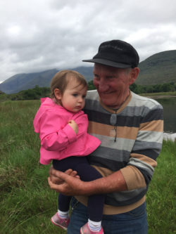 Boat captain holding girl