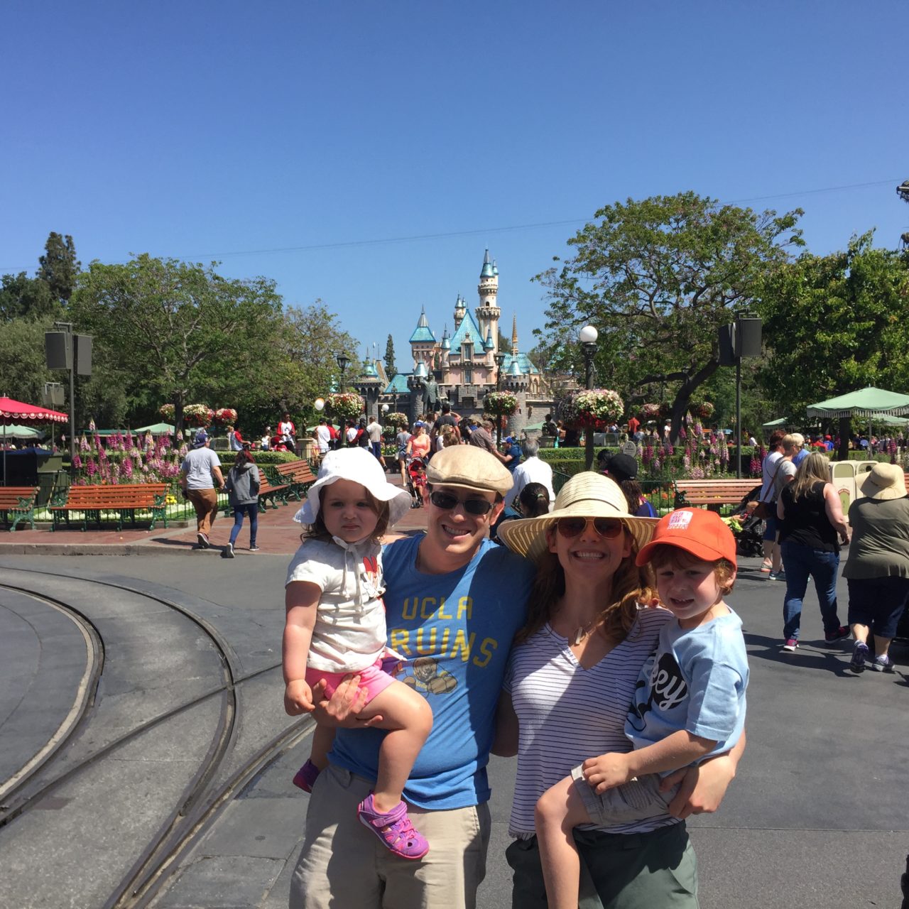 Disneyland castle family picture - it was so hard to get the kids focused on a camera when we had just walked into such a visual feast, but I think we succeeded!