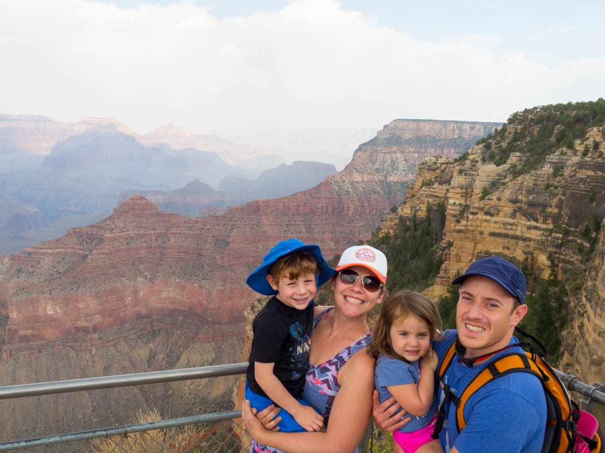 Family of four visiting the Grand Canyon with kids