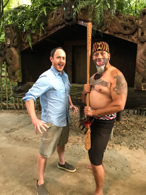 two men demonstrating haka at Tamaki Maori Village in Rotorua, New Zealand