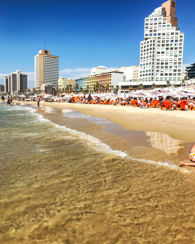 where to stay in Tel Aviv with kids - view of Gordon beach with chairs and umbrellas near the sea