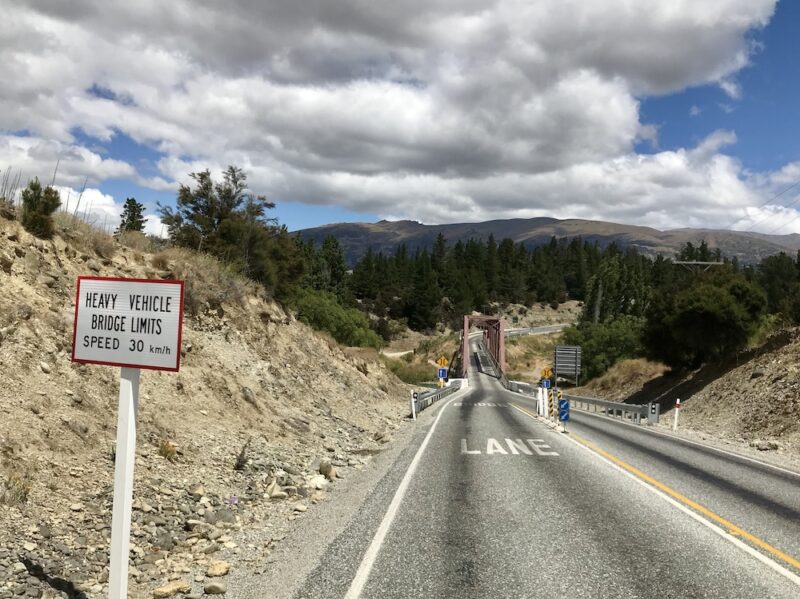 Road with a one-lane bridge in New Zealand