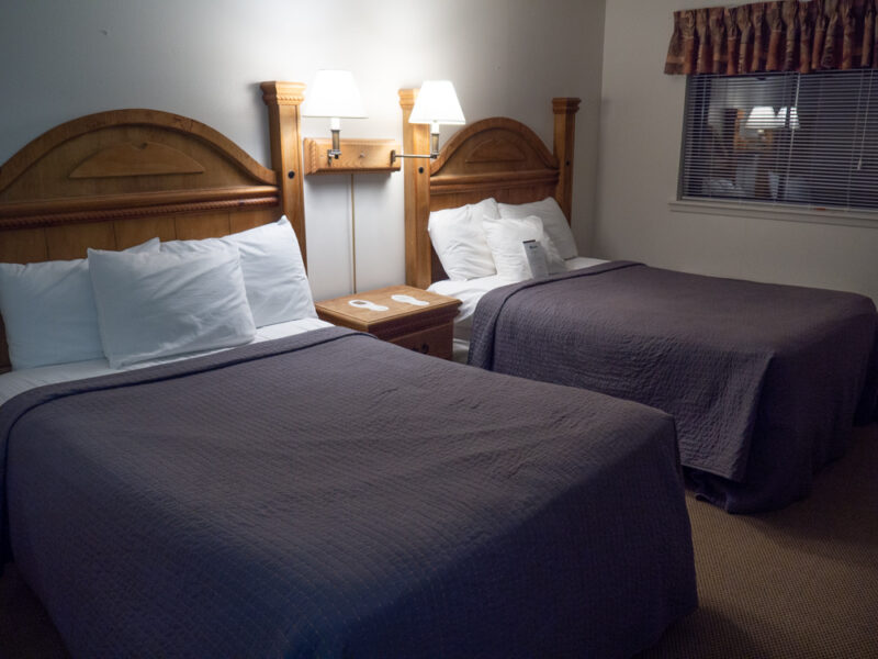 Casa Grande room at Chisos Mountain Lodge showing two beds with lamps in between