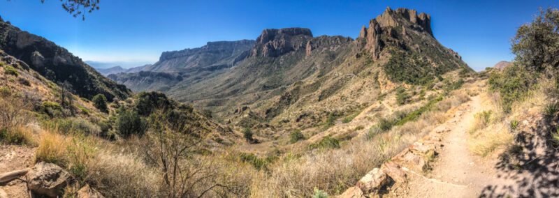 Panoramic view from the top of the Lost Mine Trail in Big Bend National Park, Chisos mountains in background and hiking trail in foreground