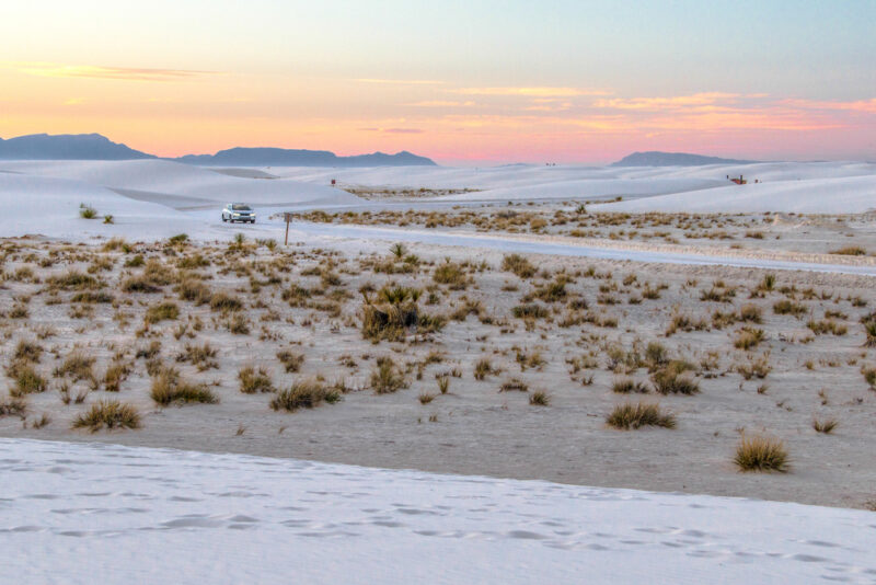 Sunset at White Sands National Park, white dunes in foreground and pink sunset in background