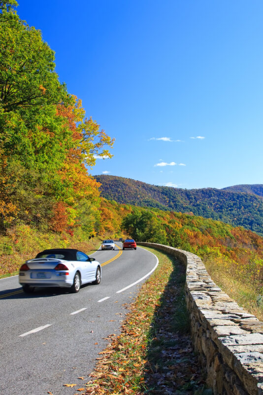 white car driving on Skyline Drive in Shenandoah National Park in autumn