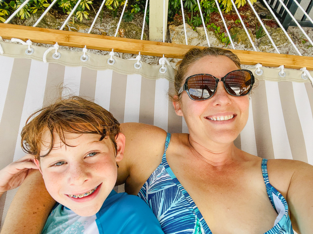 Mother and son lounging in hammock at Hyatt Regency Grand Cypress in Orlando with tweens