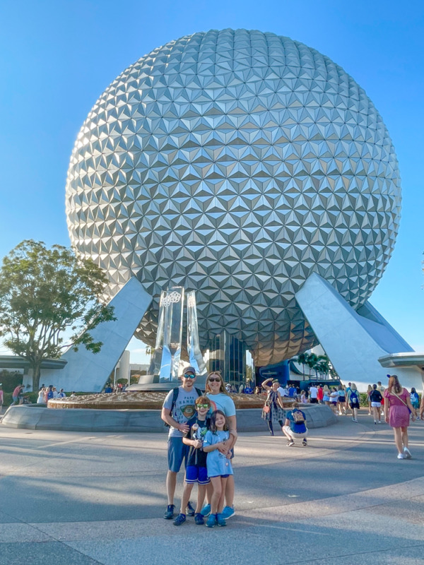 Family in front of EPCOT with tweens